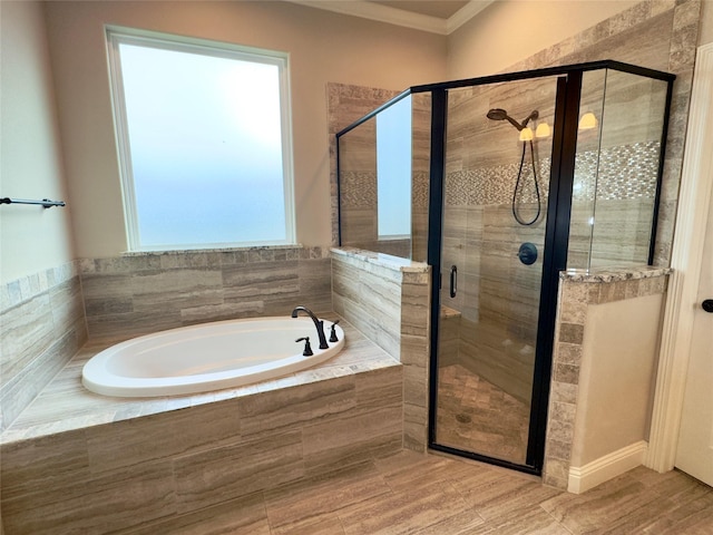 bathroom featuring a wealth of natural light, crown molding, and plus walk in shower