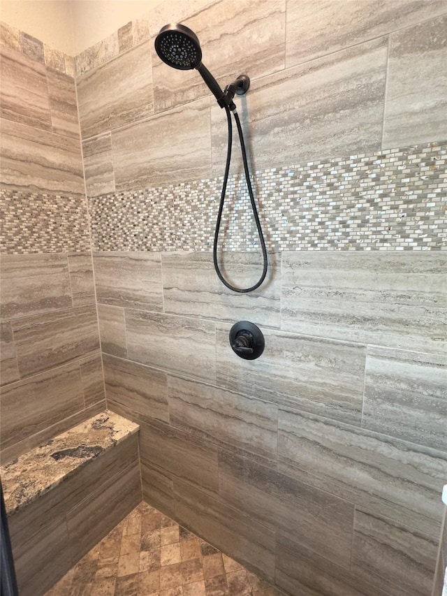 bathroom featuring tiled shower