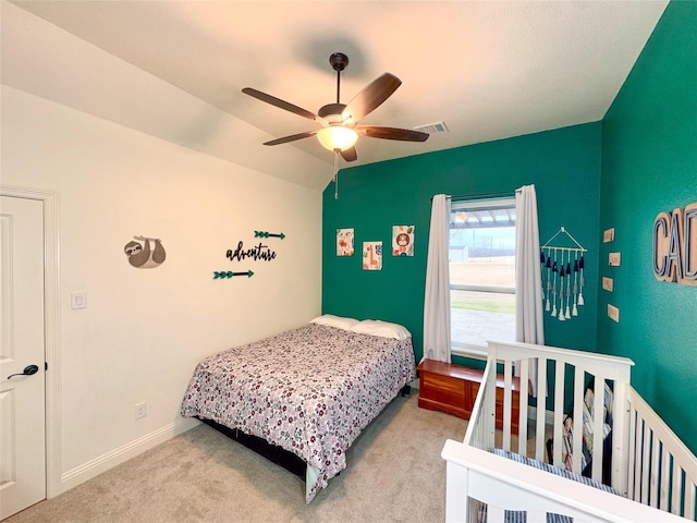 bedroom featuring ceiling fan and light colored carpet