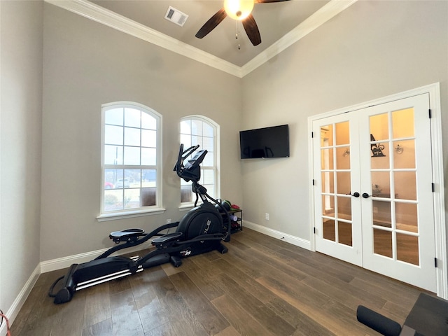 exercise area featuring ceiling fan, french doors, dark hardwood / wood-style flooring, and ornamental molding