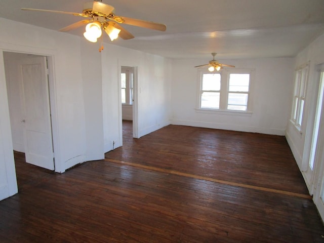 spare room featuring ceiling fan, plenty of natural light, and dark hardwood / wood-style floors