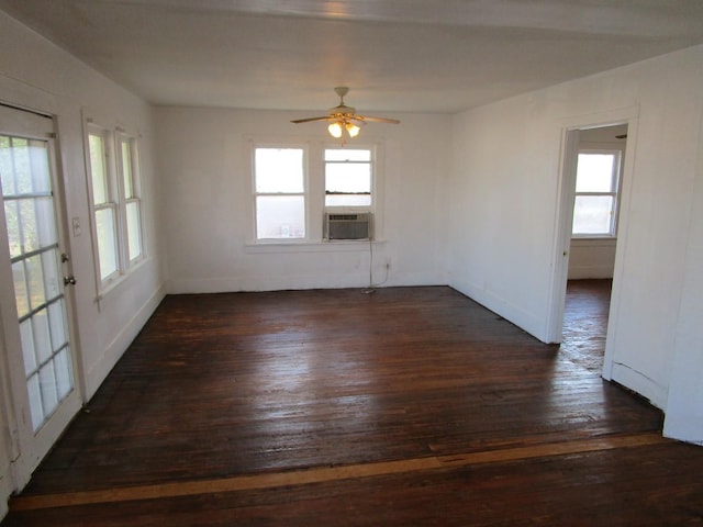 spare room featuring ceiling fan, dark hardwood / wood-style flooring, and cooling unit