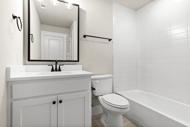 bathroom with shower / bathtub combination, toilet, wood finished floors, vanity, and visible vents