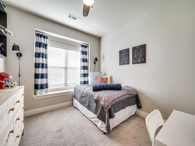 bedroom featuring ceiling fan and light colored carpet