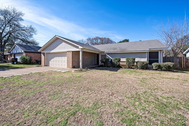 ranch-style house with a garage and a front lawn