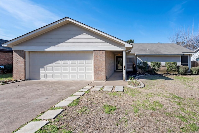 entrance to property featuring a garage and a yard