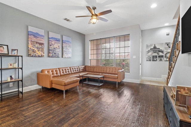 living room with ceiling fan and dark hardwood / wood-style floors