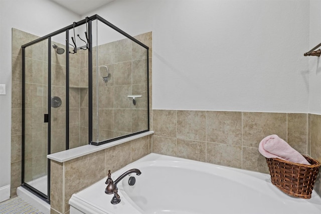 bathroom with shower with separate bathtub