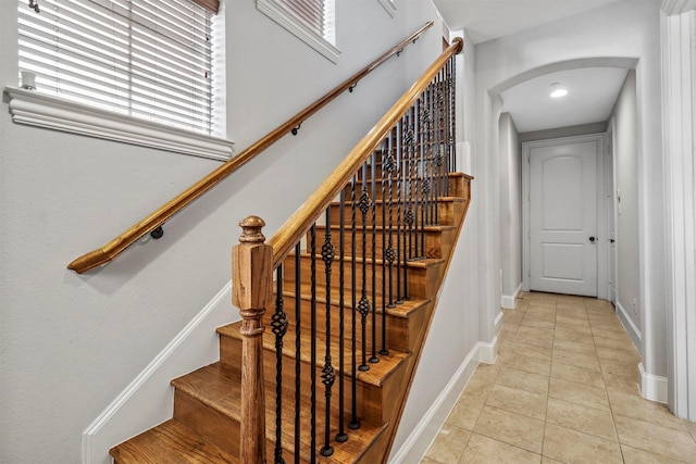 stairway featuring tile patterned floors