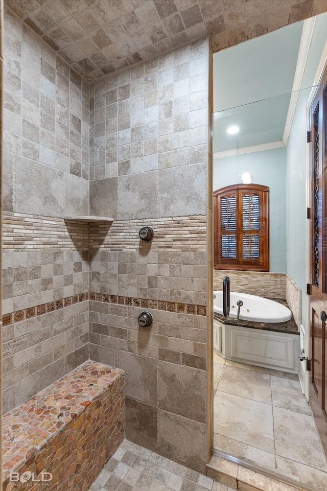 bathroom featuring ornamental molding and separate shower and tub