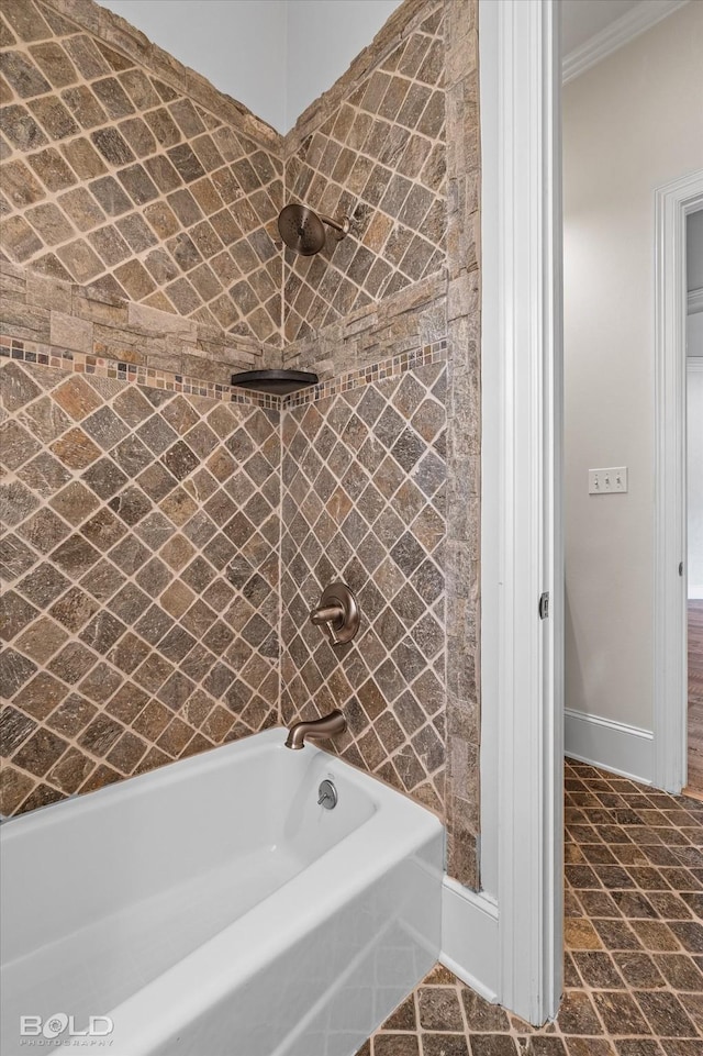 bathroom featuring crown molding and shower / bathing tub combination