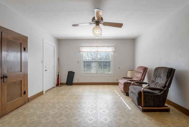 sitting room featuring ceiling fan