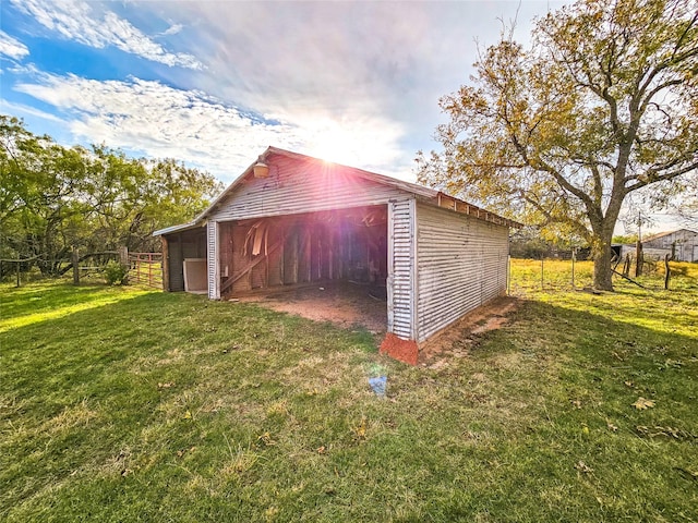 view of outbuilding featuring a yard