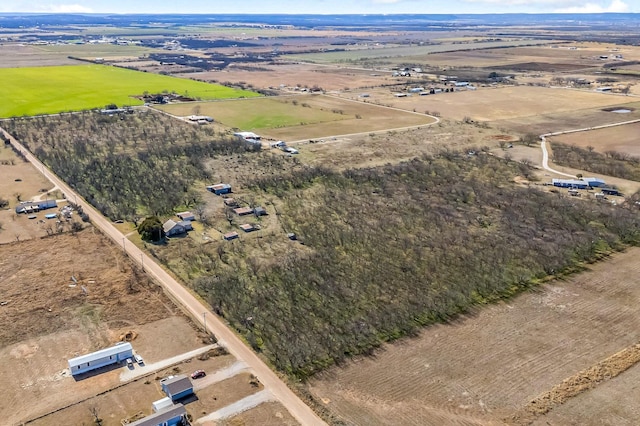 birds eye view of property with a rural view