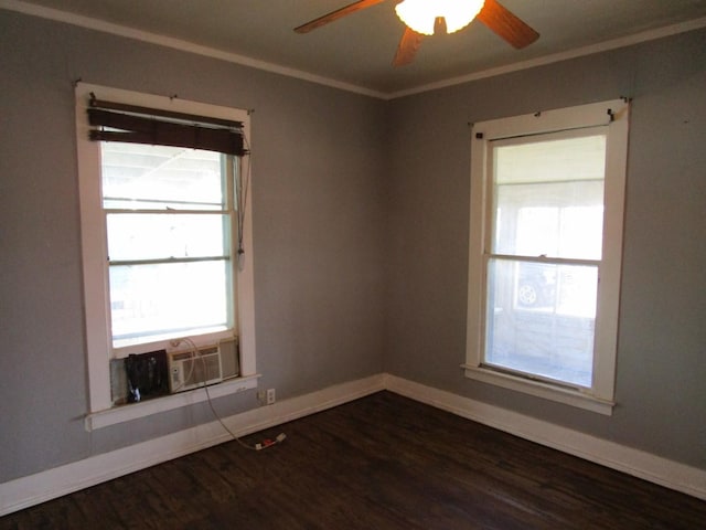 empty room with ceiling fan, dark hardwood / wood-style floors, and crown molding