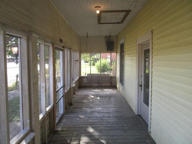 unfurnished sunroom featuring plenty of natural light