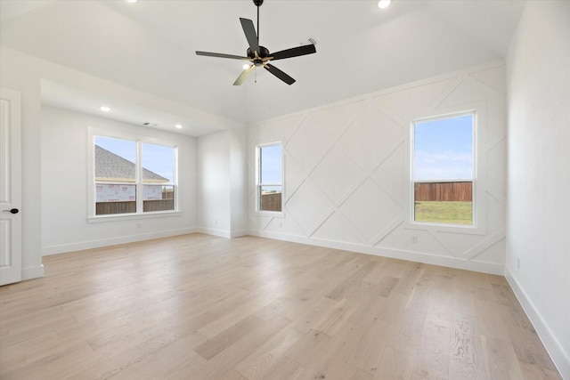 spare room featuring ceiling fan and light hardwood / wood-style floors