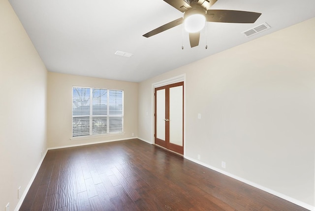 unfurnished room with dark wood-type flooring and ceiling fan