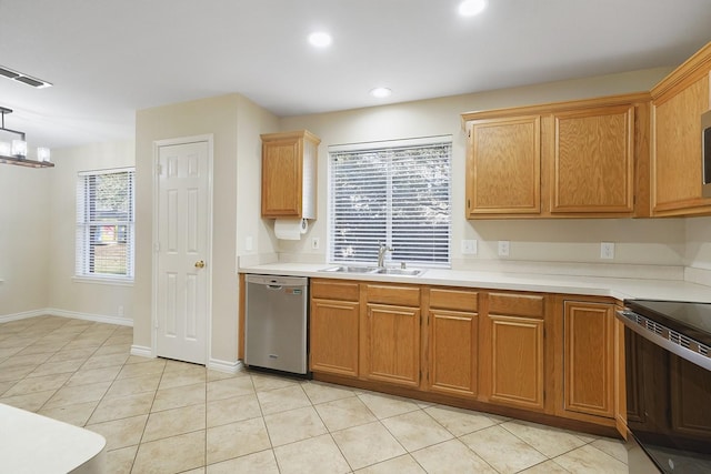 kitchen featuring a wealth of natural light, electric stove, sink, a notable chandelier, and stainless steel dishwasher