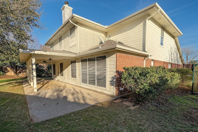 rear view of house with a patio area and ceiling fan