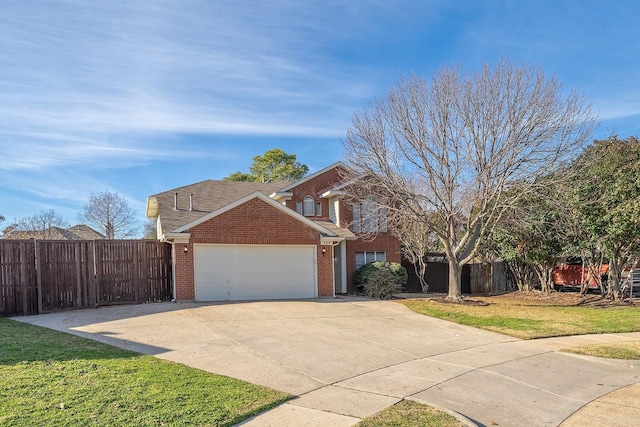 view of front of house with a garage and a front lawn