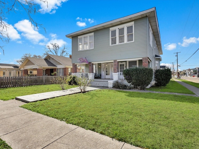 view of front of property with a front yard and a porch