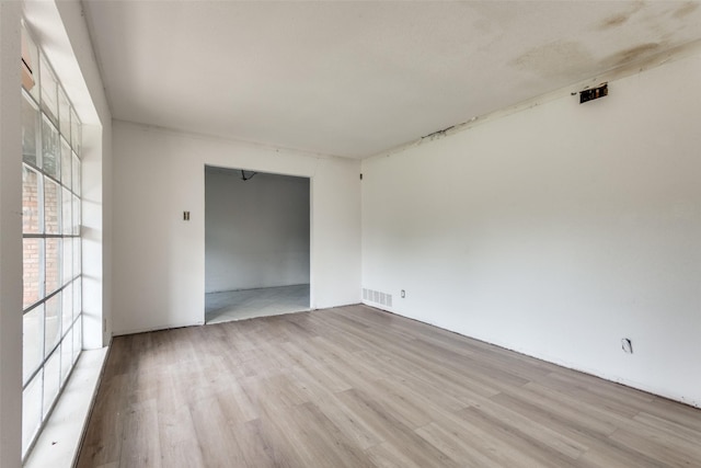 empty room with light hardwood / wood-style floors