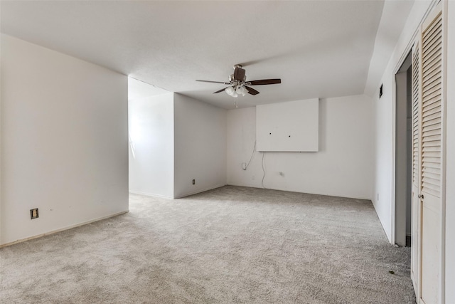 unfurnished bedroom featuring ceiling fan and light colored carpet