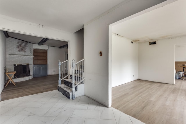 interior space with a brick fireplace