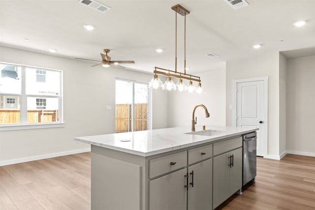 729 Tower Rd, Wylie, TX 75098 - kitchen with a sink, stainless steel dishwasher, light wood-style flooring, and visible vents