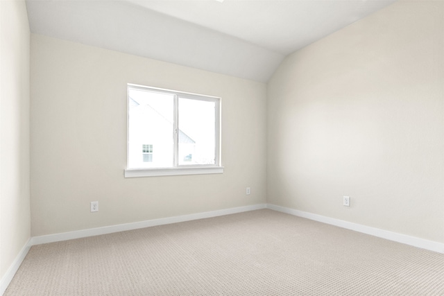 729 Tower Rd, Wylie, TX 75098 - spare room featuring baseboards, light carpet, and lofted ceiling