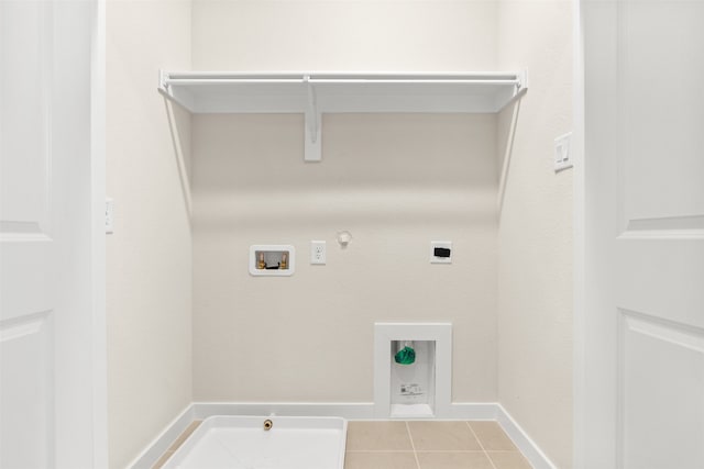 729 Tower Rd, Wylie, TX 75098 - laundry room with laundry area, hookup for a gas dryer, washer hookup, light tile patterned floors, and hookup for an electric dryer