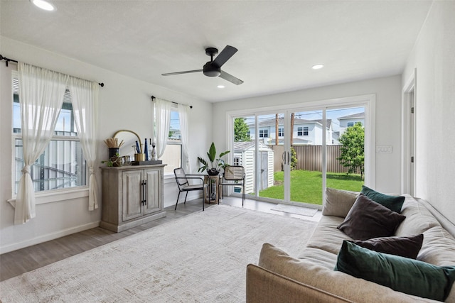 interior space featuring baseboards, recessed lighting, a ceiling fan, and wood finished floors