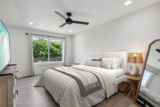 bedroom featuring recessed lighting, a ceiling fan, baseboards, and light wood finished floors