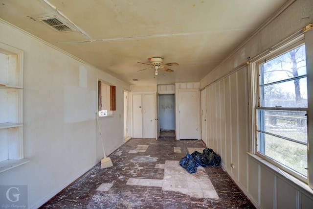 interior space featuring ceiling fan