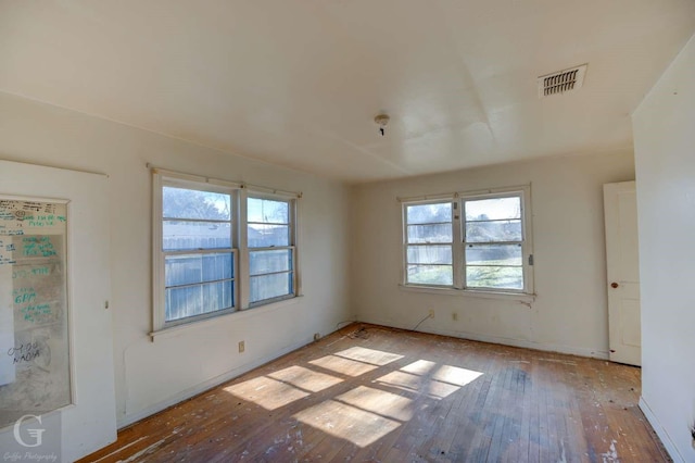 unfurnished room with light hardwood / wood-style flooring