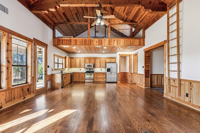 kitchen with high vaulted ceiling, ceiling fan, stainless steel appliances, and wooden ceiling