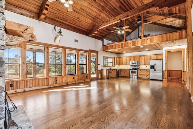 unfurnished living room featuring high vaulted ceiling, wood ceiling, beamed ceiling, and ceiling fan