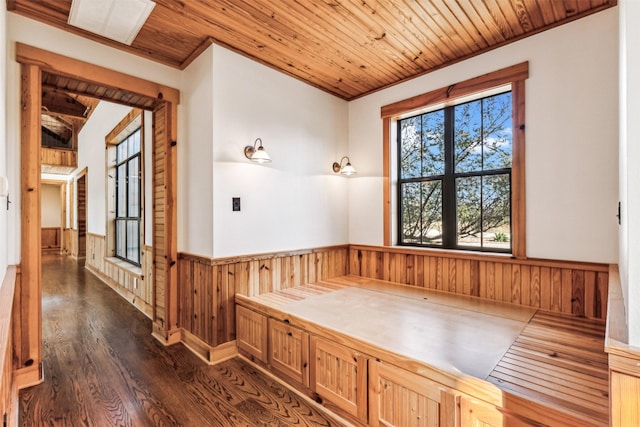 bathroom featuring wood walls, wooden ceiling, wood-type flooring, and ornamental molding