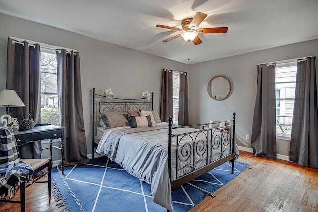 bedroom with ceiling fan and wood-type flooring