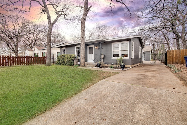 ranch-style home featuring a yard