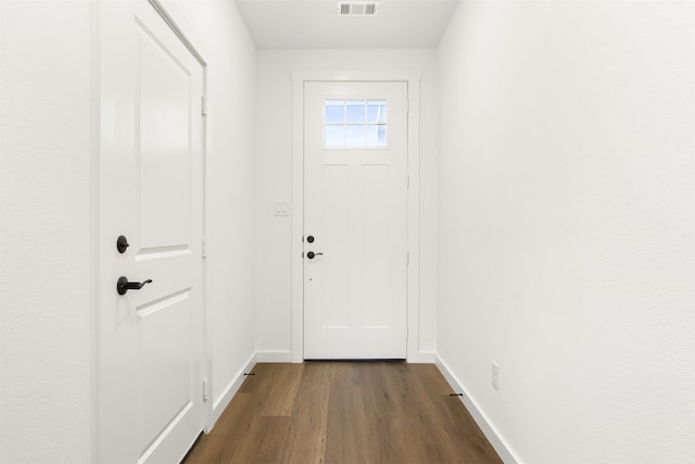 entryway featuring dark wood-style flooring, visible vents, and baseboards