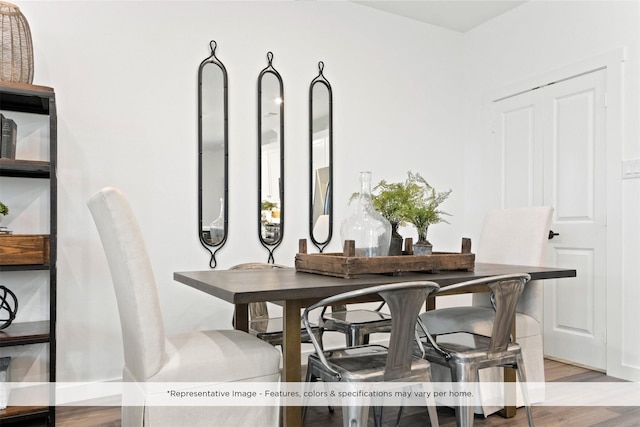 dining space with light hardwood / wood-style floors