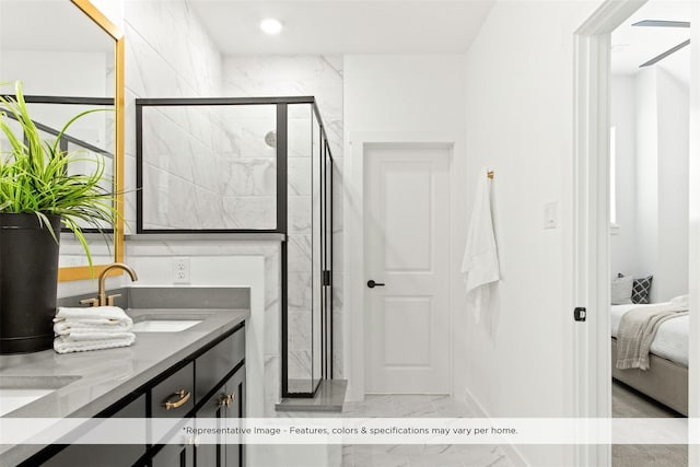 bathroom featuring an enclosed shower and vanity