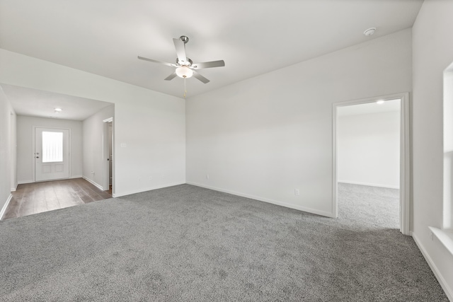 carpeted empty room with ceiling fan