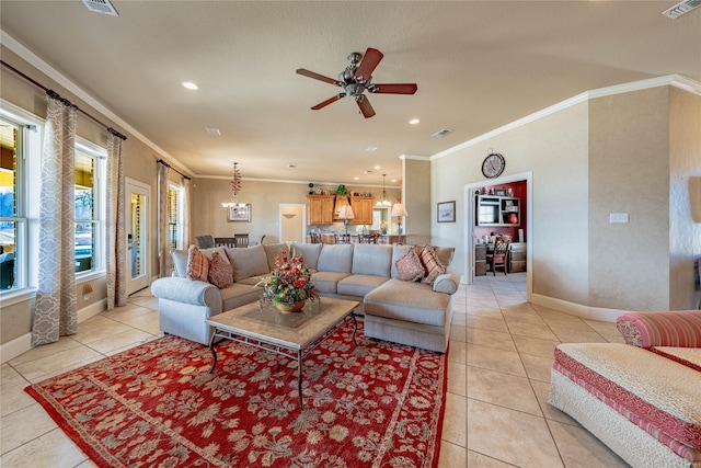 living room with ceiling fan, crown molding, and light tile patterned flooring