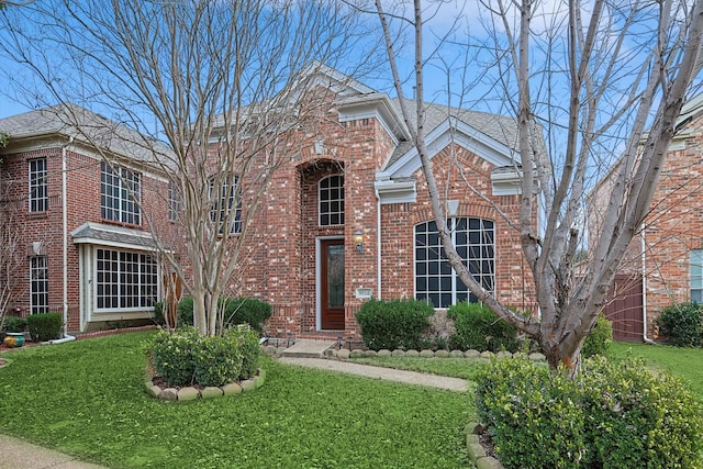 front facade with a front yard