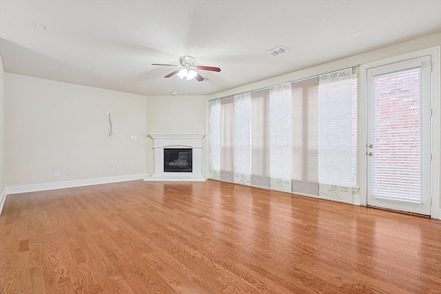 unfurnished living room featuring light hardwood / wood-style floors and ceiling fan