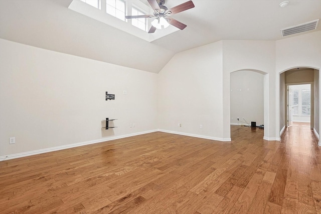 interior space with ceiling fan, hardwood / wood-style floors, and vaulted ceiling