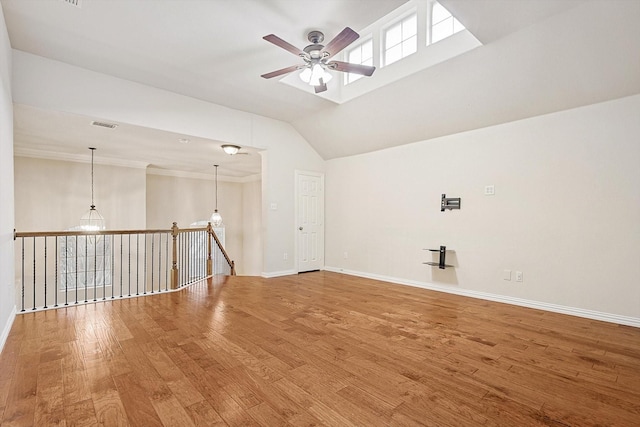 empty room with ceiling fan and hardwood / wood-style floors